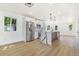 Bright, open kitchen featuring an island with waterfall countertop and stainless steel appliances at 1219 Lilac Dr, Lochbuie, CO 80603