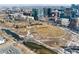 Breathtaking aerial view of an urban property near a large park with winding paths and flowing river at 1620 Little Raven St # 302, Denver, CO 80202