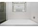 Well-lit bathroom features a soaking tub and modern fixtures at 1620 Little Raven St # 302, Denver, CO 80202