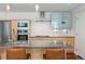 Modern kitchen featuring stainless steel appliances, pendant lighting, and counter seating at 1620 Little Raven St # 302, Denver, CO 80202