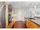 Contemporary kitchen featuring stainless steel appliances, tile backsplash, and ample counter space at 1620 Little Raven St # 302, Denver, CO 80202