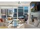 Bright living room featuring floor-to-ceiling windows, city views, and modern fireplace at 1620 Little Raven St # 302, Denver, CO 80202