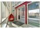 Sunny lobby with unique seating by the entrance with red accent beams and large windows at 1620 Little Raven St # 302, Denver, CO 80202