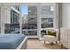 Sun-filled bedroom features large window views to the cityscape at 1620 Little Raven St # 302, Denver, CO 80202