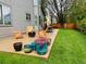 Charming patio with outdoor seating, a fire pit, and vibrant potted plants, perfect for relaxing and entertaining at 6002 Alkire Ct, Arvada, CO 80004