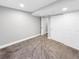 This unfinished basement has a closet and neutral paint at 6002 Alkire Ct, Arvada, CO 80004