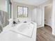 The spacious bathroom has a separate shower, soaking tub, and a window at 6002 Alkire Ct, Arvada, CO 80004