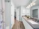 This bathroom has a double vanity, tile flooring, and a shower at 6002 Alkire Ct, Arvada, CO 80004
