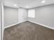Neutral-toned bedroom featuring carpeted floor, window and closet at 6002 Alkire Ct, Arvada, CO 80004