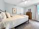 Bedroom featuring a comfortable bed, wood dresser and soft natural light at 6002 Alkire Ct, Arvada, CO 80004