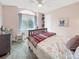 Charming bedroom with window nook, built-in shelves and unique décor at 6002 Alkire Ct, Arvada, CO 80004