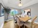 Formal dining room featuring neutral colors, tray ceiling, and modern decor at 6002 Alkire Ct, Arvada, CO 80004