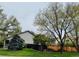 Charming home featuring a well-manicured lawn, a privacy fence, and mature trees at 6002 Alkire Ct, Arvada, CO 80004