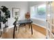 Bright home office space with a modern desk, ample natural light, and a view of the outdoors at 6002 Alkire Ct, Arvada, CO 80004