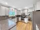 Modern kitchen with stainless steel appliances, granite counters, and ample cabinet space at 6002 Alkire Ct, Arvada, CO 80004
