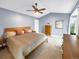 Serene main bedroom featuring a vaulted ceiling, ample natural light, and tasteful decor at 6002 Alkire Ct, Arvada, CO 80004