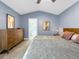 Comfortable main bedroom with neutral color palette, a ceiling fan, and a connected bathroom at 6002 Alkire Ct, Arvada, CO 80004