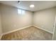 Finished basement bedroom with cozy carpet, window with natural light, and fresh paint at 1853 S Filbert Ct, Denver, CO 80222