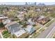 Aerial view showcasing the home's location, neighborhood and city skyline at 1930 E Martin Luther King Jr Blvd, Denver, CO 80205