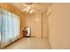 A minimalist bedroom with bright walls and a ceiling fan, perfect for personalization at 1930 E Martin Luther King Jr Blvd, Denver, CO 80205