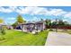 Spacious backyard featuring a gazebo with outdoor dining, a basketball hoop, and lush green grass at 41 S Fenton St, Lakewood, CO 80226