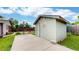 Backyard view featuring a basketball hoop, a storage shed, a fire pit, and a well-maintained grassy area at 41 S Fenton St, Lakewood, CO 80226