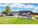 Outdoor patio with gazebo, green lawn, and well-maintained landscaping create a perfect entertaining space at 41 S Fenton St, Lakewood, CO 80226