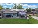 Aerial view of home featuring a large backyard with green lawn, patio area, and solar panels on the roof at 41 S Fenton St, Lakewood, CO 80226