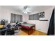 Comfortable bedroom offers a modern setup with a gaming area and ample natural light for versatile use at 41 S Fenton St, Lakewood, CO 80226