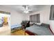 Bright bedroom with ceiling fan, hardwood floors, and a large window that brings in plenty of natural light at 41 S Fenton St, Lakewood, CO 80226