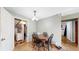 Cozy dining area featuring wood floors, a chandelier, and classic furniture at 41 S Fenton St, Lakewood, CO 80226