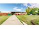 Charming single story home with well-maintained lawn, beautiful landscaping, and solar panels at 41 S Fenton St, Lakewood, CO 80226
