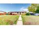Charming single story home with well-maintained lawn, beautiful landscaping, and solar panels at 41 S Fenton St, Lakewood, CO 80226