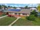 Cozy single-story house featuring solar panels, a manicured front yard, and a peaceful neighborhood setting at 41 S Fenton St, Lakewood, CO 80226