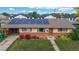 Attractive single-story residence with solar panels, brick accents, a neat front lawn, and residential street view at 41 S Fenton St, Lakewood, CO 80226