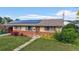 Charming single-story home featuring solar panels, well-maintained lawn, and inviting curb appeal at 41 S Fenton St, Lakewood, CO 80226