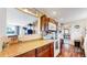 Functional kitchen with wood cabinets, laminate countertops, and modern appliances at 41 S Fenton St, Lakewood, CO 80226