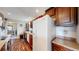 Functional kitchen with wood cabinets, laminate countertops, and modern appliances at 41 S Fenton St, Lakewood, CO 80226