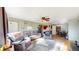 Inviting living room featuring wood floors, a ceiling fan, neutral paint, and comfortable seating at 41 S Fenton St, Lakewood, CO 80226