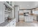 Spacious kitchen with custom cabinets, stainless steel appliances, and wine rack at 23525 Painted Hills St, Parker, CO 80138