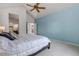 Inviting main bedroom with vaulted ceilings, ceiling fan, and ensuite bathroom at 23525 Painted Hills St, Parker, CO 80138