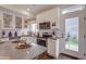 Modern kitchen with stainless steel appliances, white cabinets, and an island with seating at 1212 Sugarloaf Ln, Erie, CO 80516