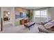 Inviting living room with a large window, media center, comfortable seating, and neutral tones at 1212 Sugarloaf Ln, Erie, CO 80516