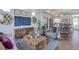 Comfortable living room with modern decor, stylish furniture, and a large screen TV at 1212 Sugarloaf Ln, Erie, CO 80516