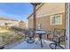 Covered back patio with seating area perfect for enjoying the outdoors at 5177 Delphinium Cir, Brighton, CO 80601