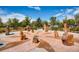 The community park features a unique sun dial design with boulders and seating areas at 5177 Delphinium Cir, Brighton, CO 80601