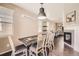 Bright dining area featuring a dining table and chairs with view of the living room at 5177 Delphinium Cir, Brighton, CO 80601