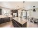 Well-designed kitchen with granite countertops, stainless steel appliances, and eat in kitchen space at 5177 Delphinium Cir, Brighton, CO 80601