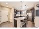 Modern kitchen with granite countertops, stainless steel appliances, and a center island at 5177 Delphinium Cir, Brighton, CO 80601