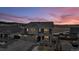 Two-story home with attached garage, visible from above at dusk at 1210 Horsetail Loop, Elizabeth, CO 80107